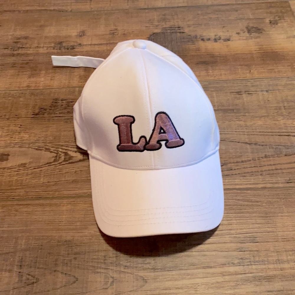 LA white hat with purple writing